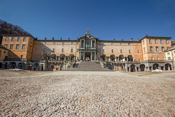 Naklejka premium Panoramic view of the inner courtyard of the seventeenth-century monumental complex dedicated to the Virgin Mary, of the Sanctuary of Oropa in Piedmont, Italy.