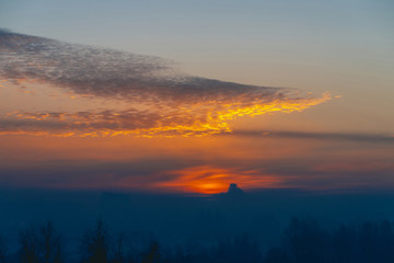 Sunny shine on clouds. Wonderful vivid dawn. Beautiful calm sunset. Scenic tranquil sunrise. Amazing peaceful cloudy sky. Sun above horizon. Picturesque sundown. Atmospheric cloudscape. Background.