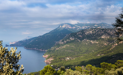 view from the tower to the sea and mountains; mountains overgrown with forests; scenic resting places
