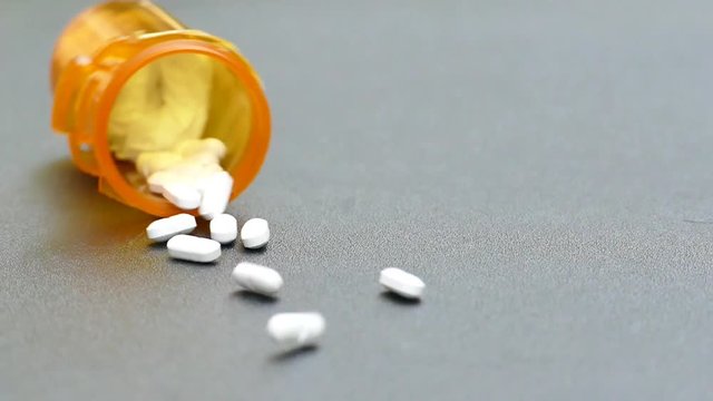Pills  Spilling From Pill Bottle Slow Motion