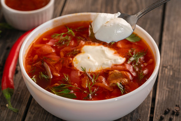 photo for menu, Russian borscht with sour cream garlic pepper and sauce, Ukrainian borscht with sour cream