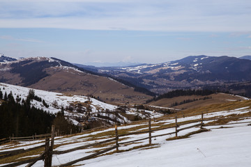 Fototapeta na wymiar Spring vs winter landscape in the Carpathian mountains 