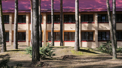 Fototapeta na wymiar GRODNO, BELARUS - MARCH 2, 2019: Sanatorium ENERGETIK. Residential buildings in the pine forest.
