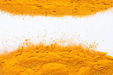 Turmeric powder on white background, close-up image
