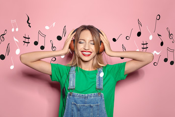 Beautiful young woman with healthy long blonde hair and headphones on color background