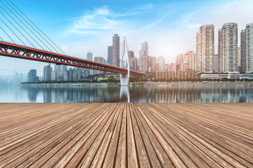 Fototapeta premium Urban skyscrapers with empty square floor tiles