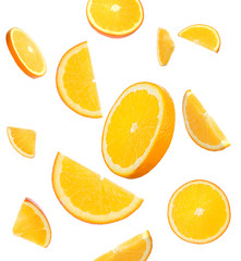 Flying juicy orange slices on white background