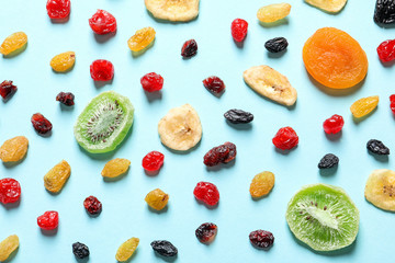 Flat lay composition with different dried fruits on color background. Healthy lifestyle