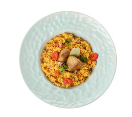 Plate with rice pilaf and meat on white background, top view