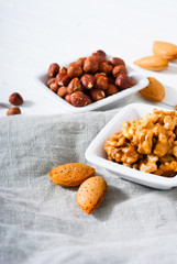 hard shell stone fruits on white wood table background