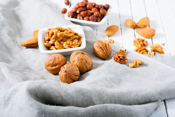 hard shell stone fruits on white wood table background