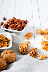 hard shell stone fruits on white wood table background
