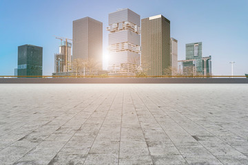 Urban skyscrapers with empty square floor tiles