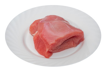Raw turkey slice on a plate isolated