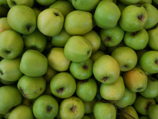 Stack of green apples at a greengrocer