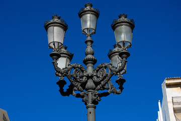 Fototapeta na wymiar Old street lamp on Valencia street. Valencia, Spain