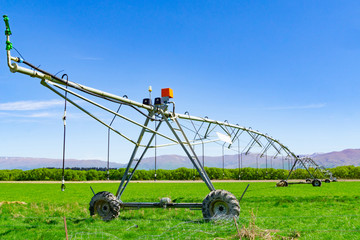 Large centre pivot irrigation system running on a farm in Canterbury, New Zealand