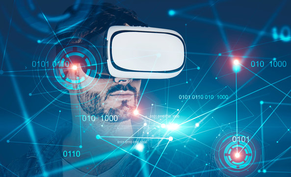Casual man in VR goggles, binary code and hud