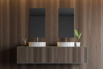 Dark wooden bathroom with double sink close up