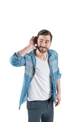 Young casual man listening, isolated