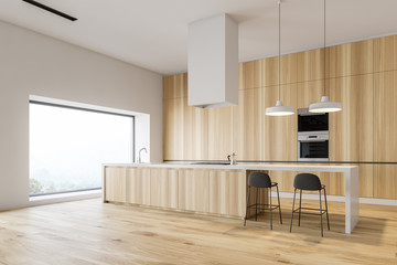 Wooden kitchen corner with bar and ovens