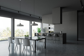 Gray kitchen corner with table and bar