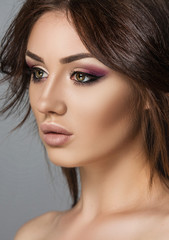 Girl with purple eye makeup. Fashion photo