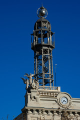Fototapeta na wymiar Tower of the Post and telegraph building (Oficina de Correos) near Town Hall Square. Valencia, Spain