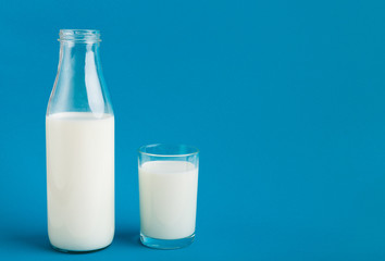 Glass bottle and glass with milk