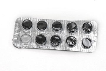 opened pack of black pills