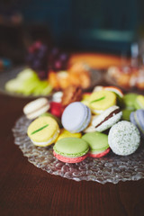 A stack of colorful macaroons on the plate