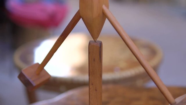 Wooden souvenir on the table in Morocco street Market. Equilibrium balanceer with two sinkers
