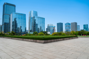 Urban skyscrapers with empty square floor tiles