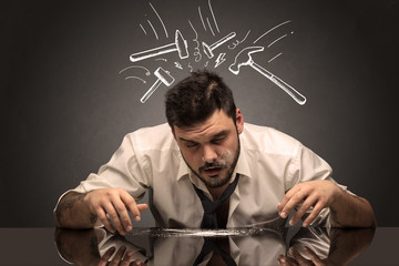 Young drunk disappointed man with hangover concept
