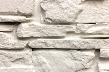 Close-up of white solid limestone wall or stone fence. Abstract copy space background, Bricklaying,...