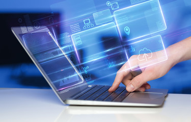 Hand using laptop with database reports and online work concept
