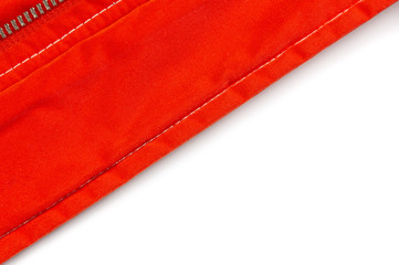 Edge of a Red Windbreaker on a White Background