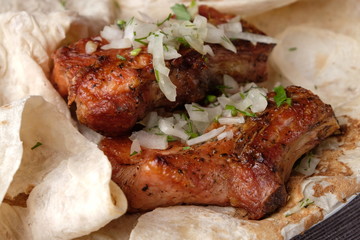 grilled ribs close up on pita bread
