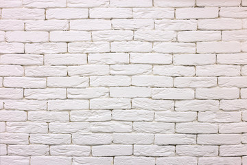 Close-up of white painted whitewashed solid brick wall. Abstract