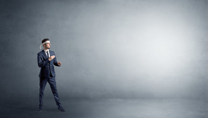 Small karate man fighting in an empty grey copy space