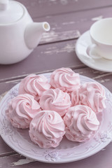 Traditional Russian homemade merengue marshmallow or zephyr on a plate on wooden background