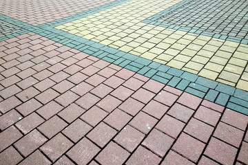 Stone pavement in perspective. Granite cobblestone pavement tiles.