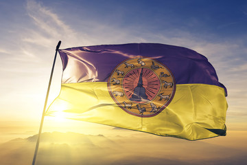 Nakhon Si Thammarat province of Thailand flag waving on the top sunrise mist fog