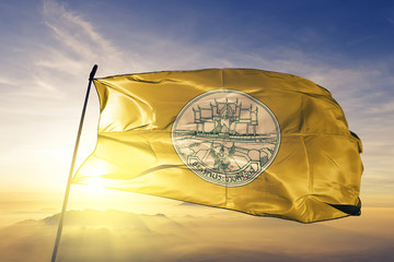 Prachuap Khiri Khan province of Thailand flag waving on the top sunrise mist fog
