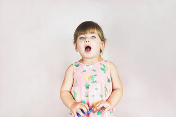 Young little and funny girl in a studio shot