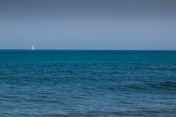 Fototapeta na wymiar Mediterranean sea with a sailboat