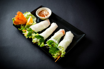 Spring rolls with vegetables in noodle tube. Vegetables in rice noodle tube