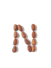 Isolated alphabet letter N made by almonds