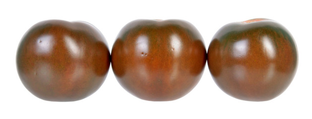 Three ripe brown tomatoes isolated on white background