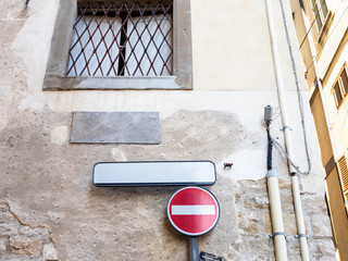 No Entry road sign on the street corner in Bergamo